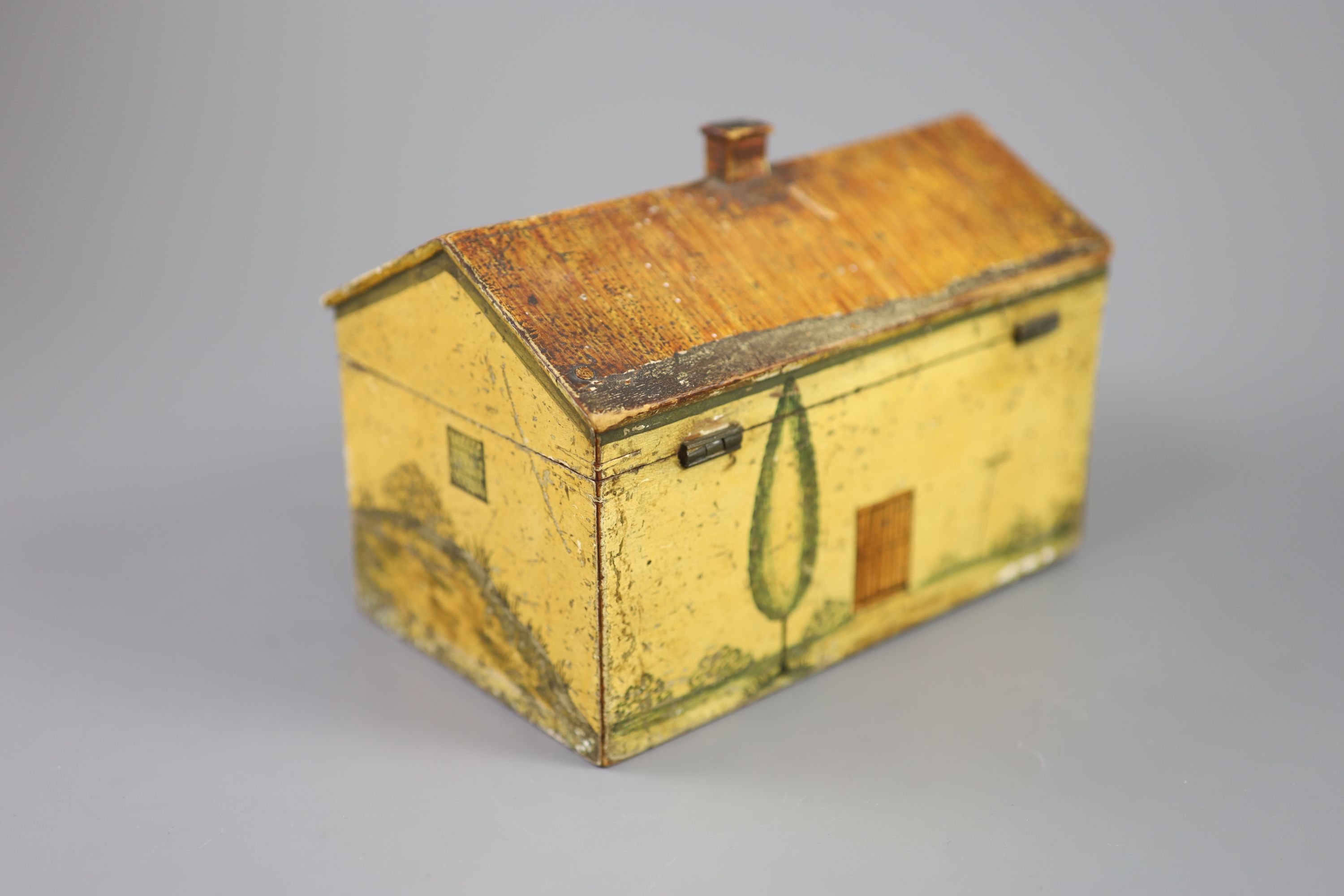 A Regency painted and penwork work box, modelled as a cottage, width 7.25in. depth 4.5in. height 5in.
